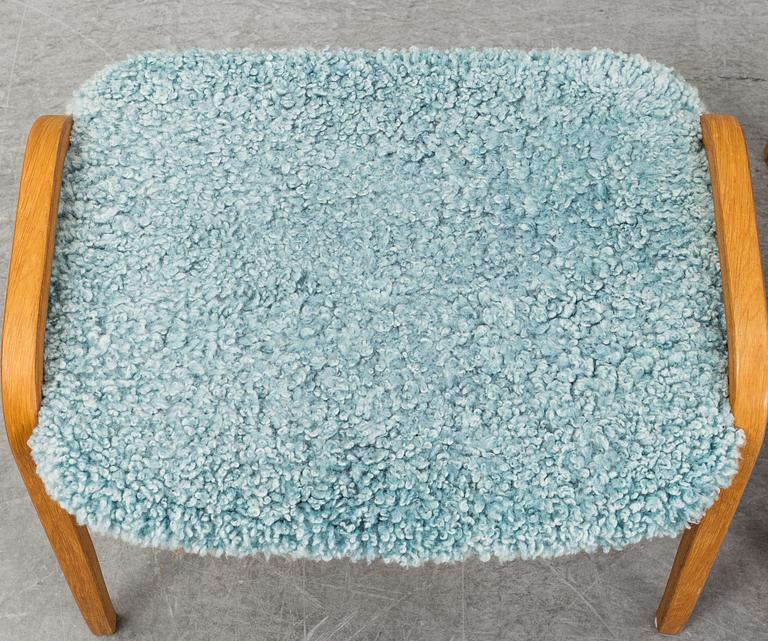 YNGVE EKSTRÖM, a 'Lamino' armchair with a stool, Swedese.
