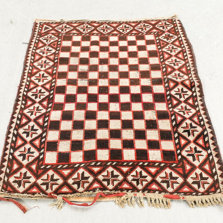 A semaintique/antique beludj carpet ca 115x86 cm.