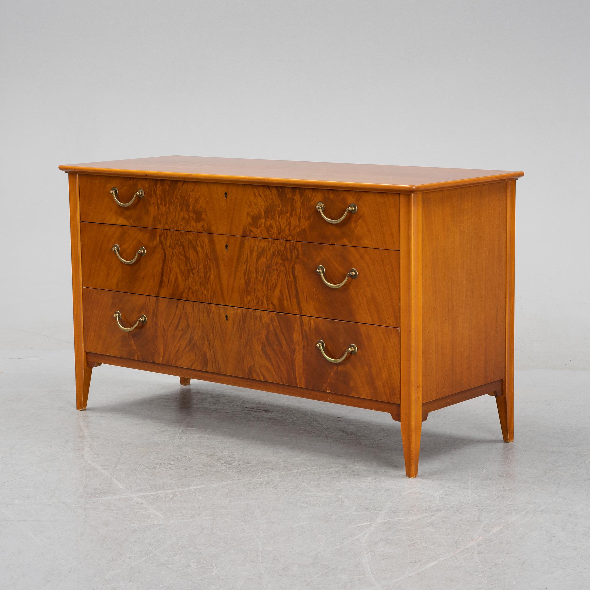 A Swedish Modern mahogany chest of drawers, 1940's/50's.