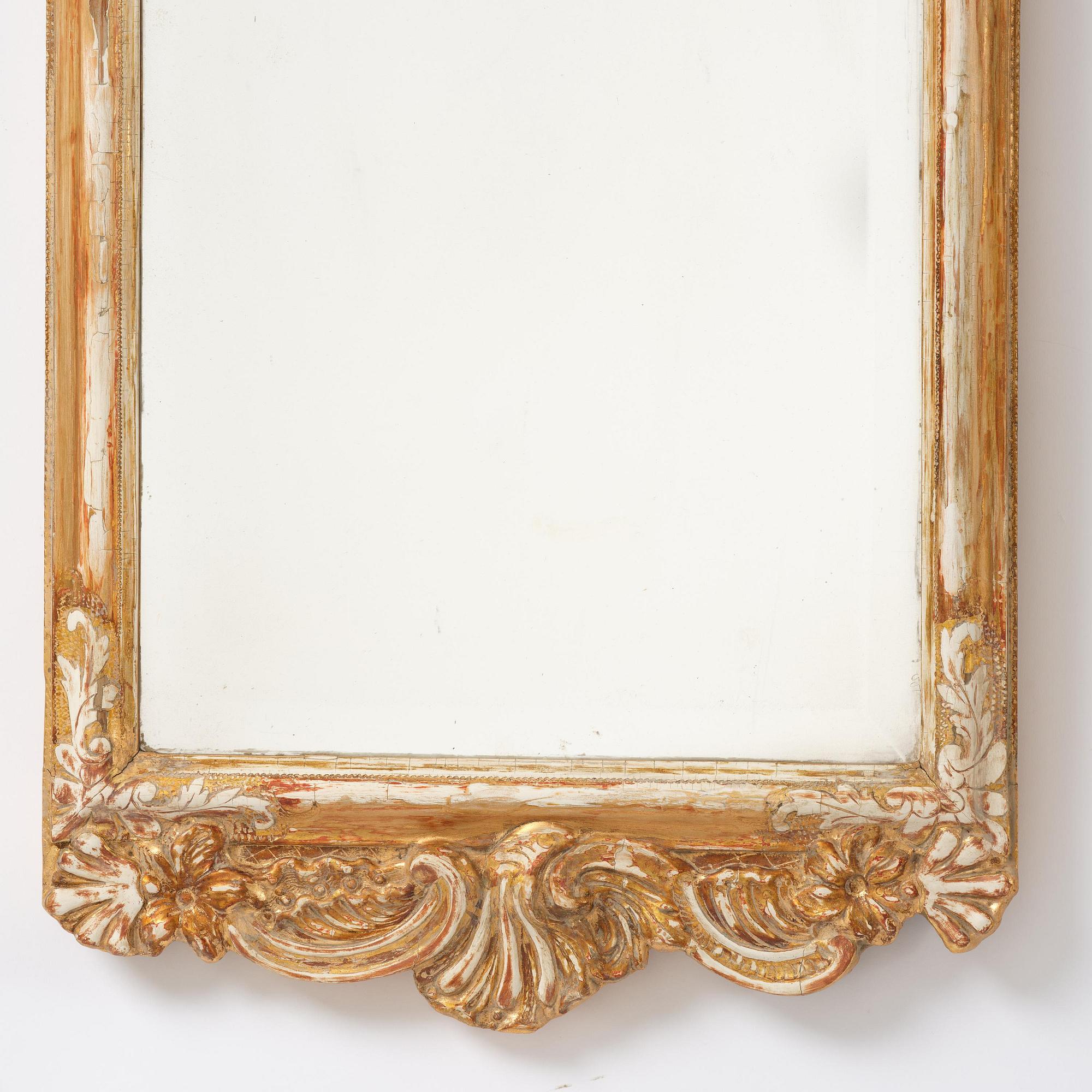 A Swedish Rococco mirror, late 18th century.