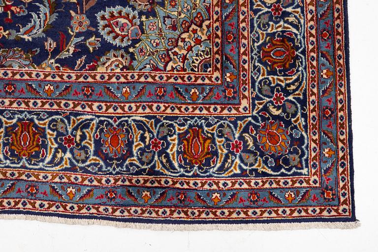 An oriental carpet, c. 390 x 295 cm.