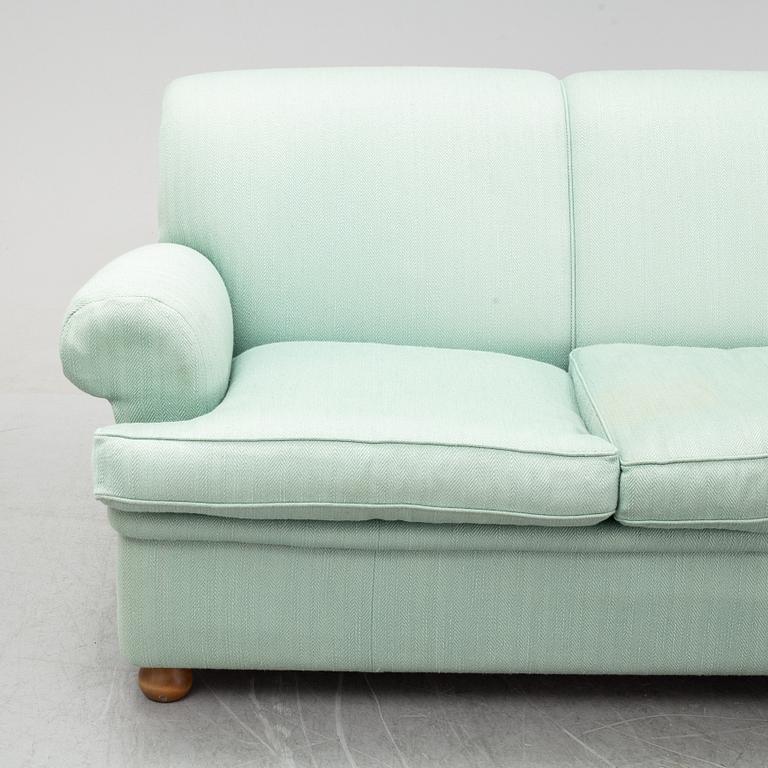 A model 703 sofa by Josef Frank for Firma Svenskt Tenn.