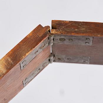 A Gustavian 'concertina action' mahogany games table by Georg Haupt (master in Stockholm 1770-84).