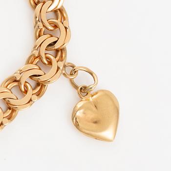 Bracelet 18K gold with charms.