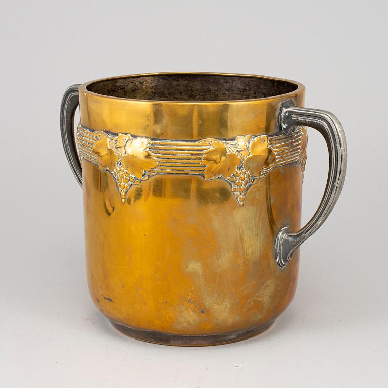 An art nouveau brass champagne cooler, early 20th century.