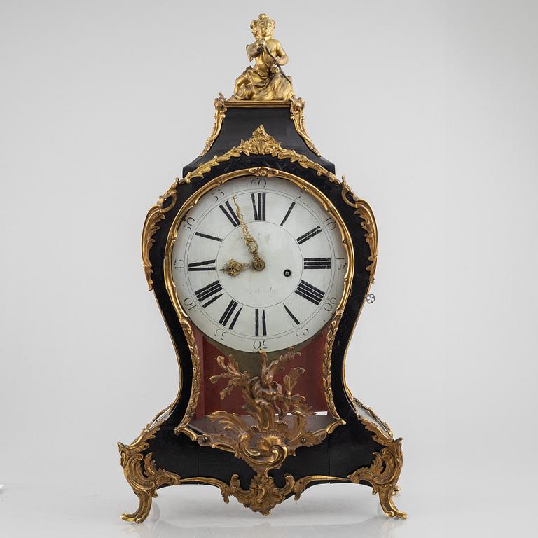 Clock, Rococo style with partially older parts, around the year 1900.