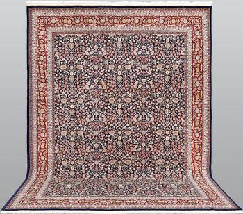 A signed Hereke carpet, ca 340 x 246 cm.