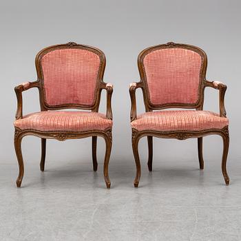 A pair of 19th-century rococo revival arm-chairs.