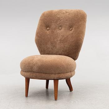 A mid 20th century easy chair,.