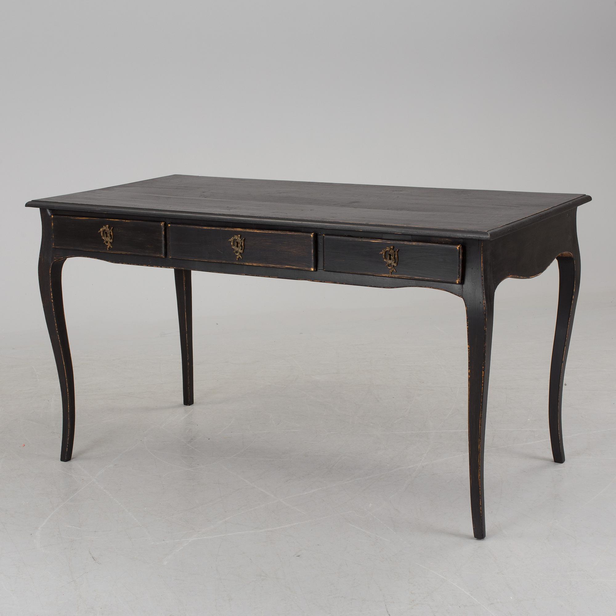 A partially rococo, 18th century writing desk.