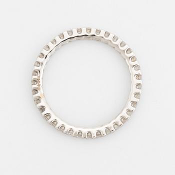 Brilliant-cut diamond eternity ring.