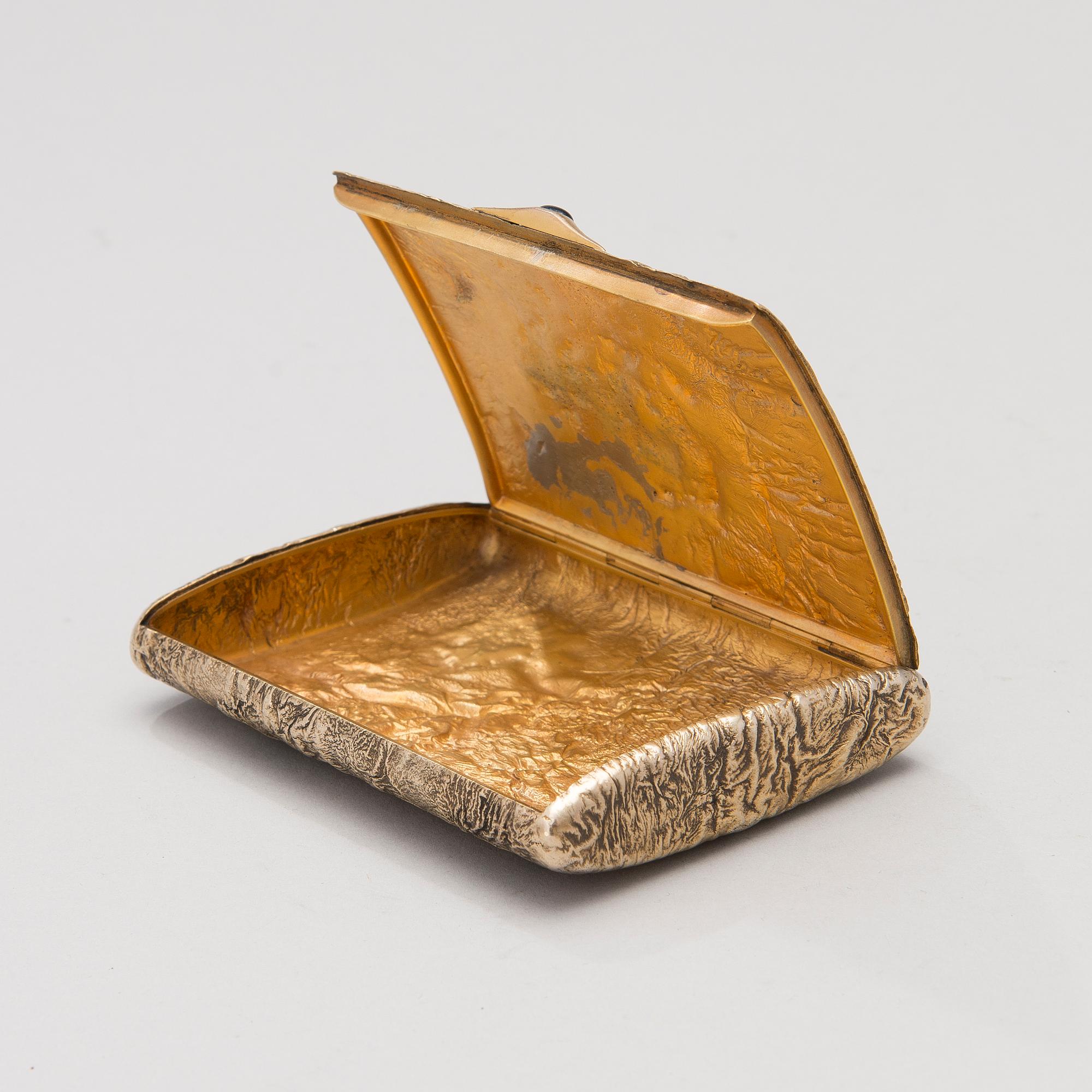 A silver gilt cigarette case by Ivan Katorskij, Saint Petersburg 1896-1908.