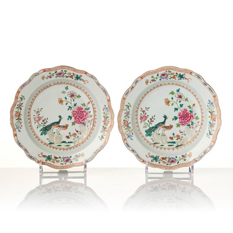 A group of famille rose 'double peacock' serving dishes, Qing dynasty, Qianlong (1736-95). (8 pieces).
