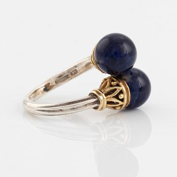 An Ilias Lalaounis ring in silver and 18K gold with sodalite.