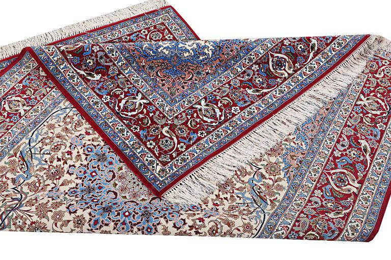 An Esfahan rug, part silk, figural, c. 243 x 158 cm.