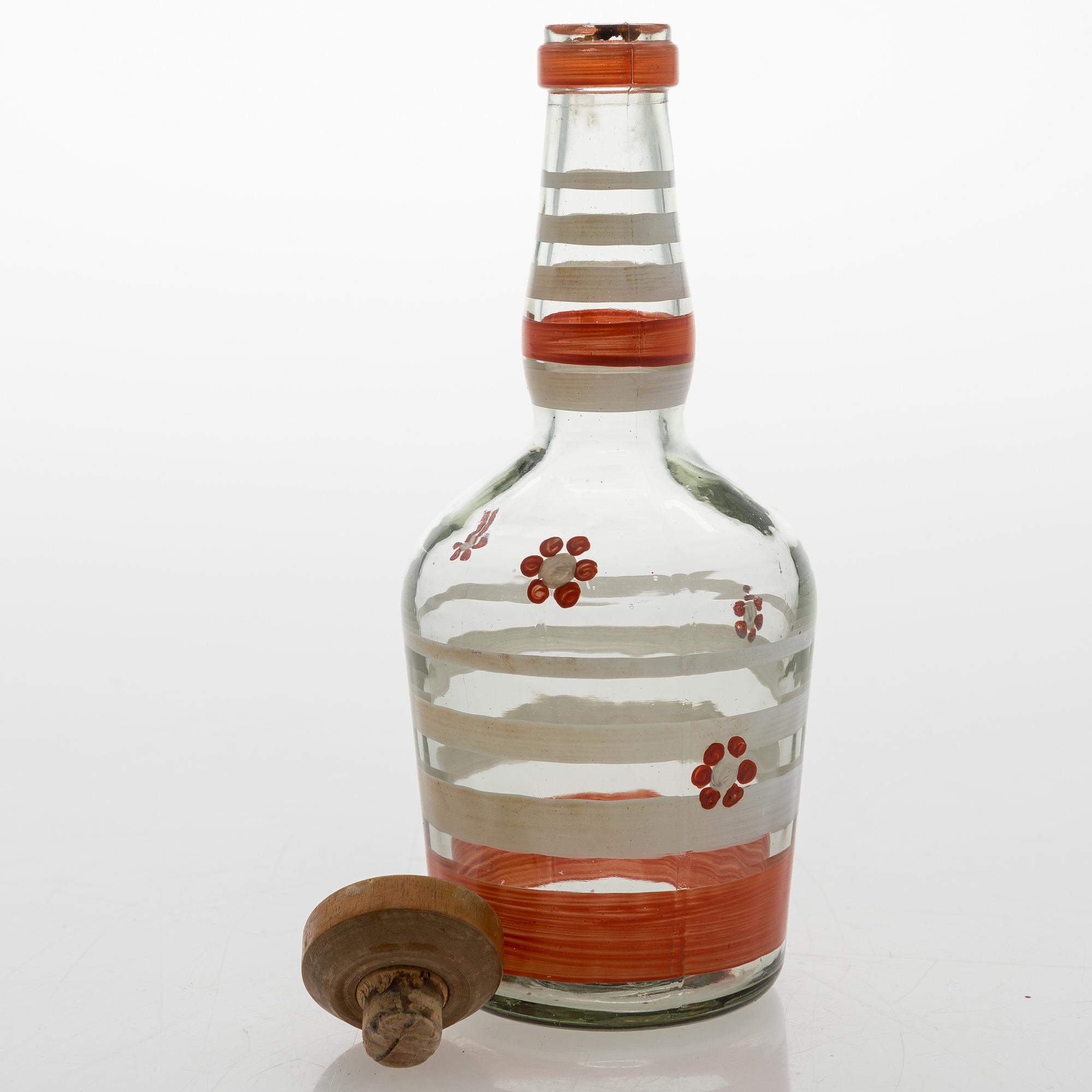 A set of 6 snapsglasses and a bottle designed by Aino Aalto for Karhula in the 1930-1940's.