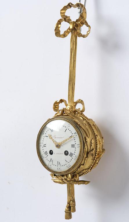 A French Louis XVI-style gilt-bronze cartel clock, 19th century.