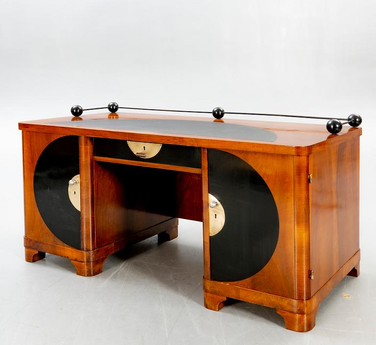 An Art Deco walnut desk.