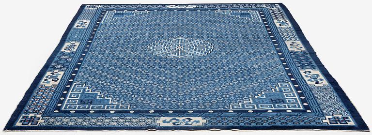 A semi-antique Baotou carpet, West China, c. 335 x 246 cm.