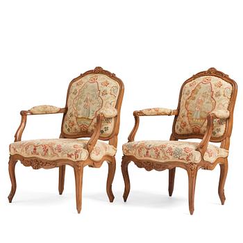 43. A matched pair of French Louis XV armchairs, mid 18th century.