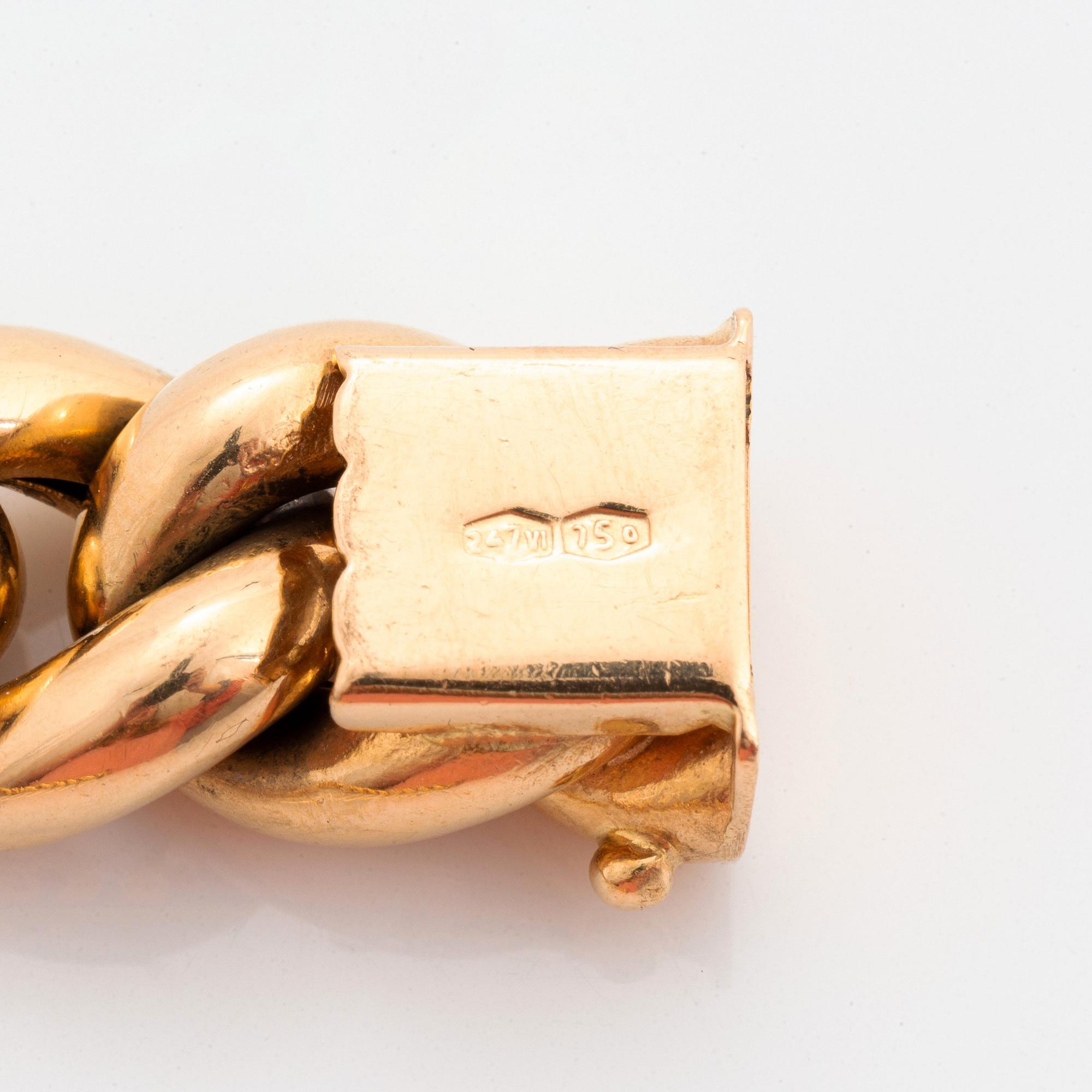 An 18K gold bracelet.