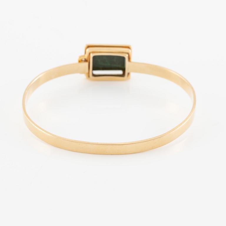 Bracelet 18K gold with green stone.