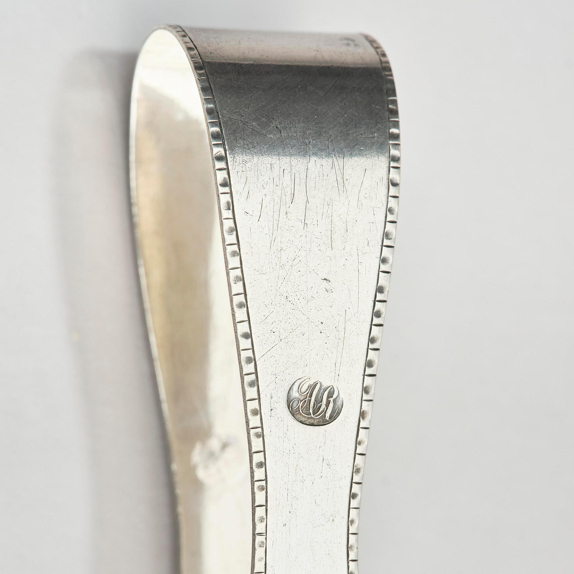 A Swedish 19th century silver sugar-casket and tong, marks of Adolf Zethelius, Stockholm 1819.