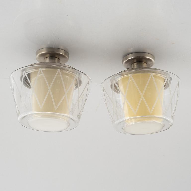 Harald Notini, taklampor, ett par, modell "11197", Arvid Böhlmarks Lampfabrik, Stockholm, 1940-50-tal.