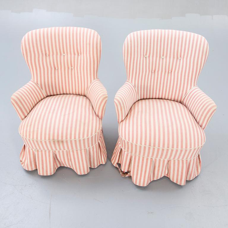 A pair of Modern easy chairs.