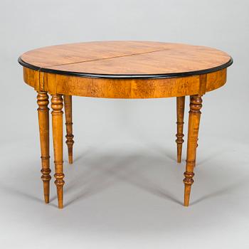 A birch veneered dining table, second half of the 19th Century.