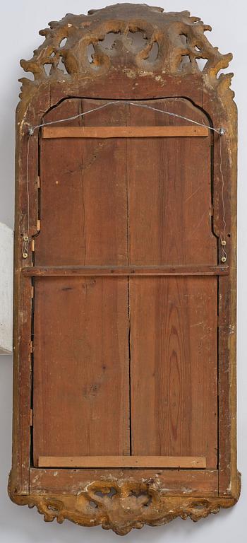 A Swedish gitlwood rococo mirror, Stockholm, later part 18th century.