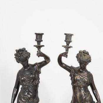 Auguste Moreau after a pair of sculptures/candle sticks patinated bronze.