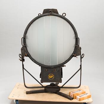 A film industry carbon arc spotlight with two boxes Kino-carbon sticks, + and -.