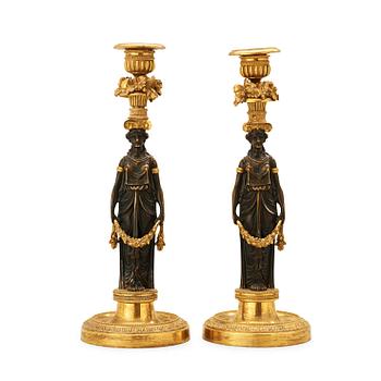 A pair of Empire early 19th century candlesticks.