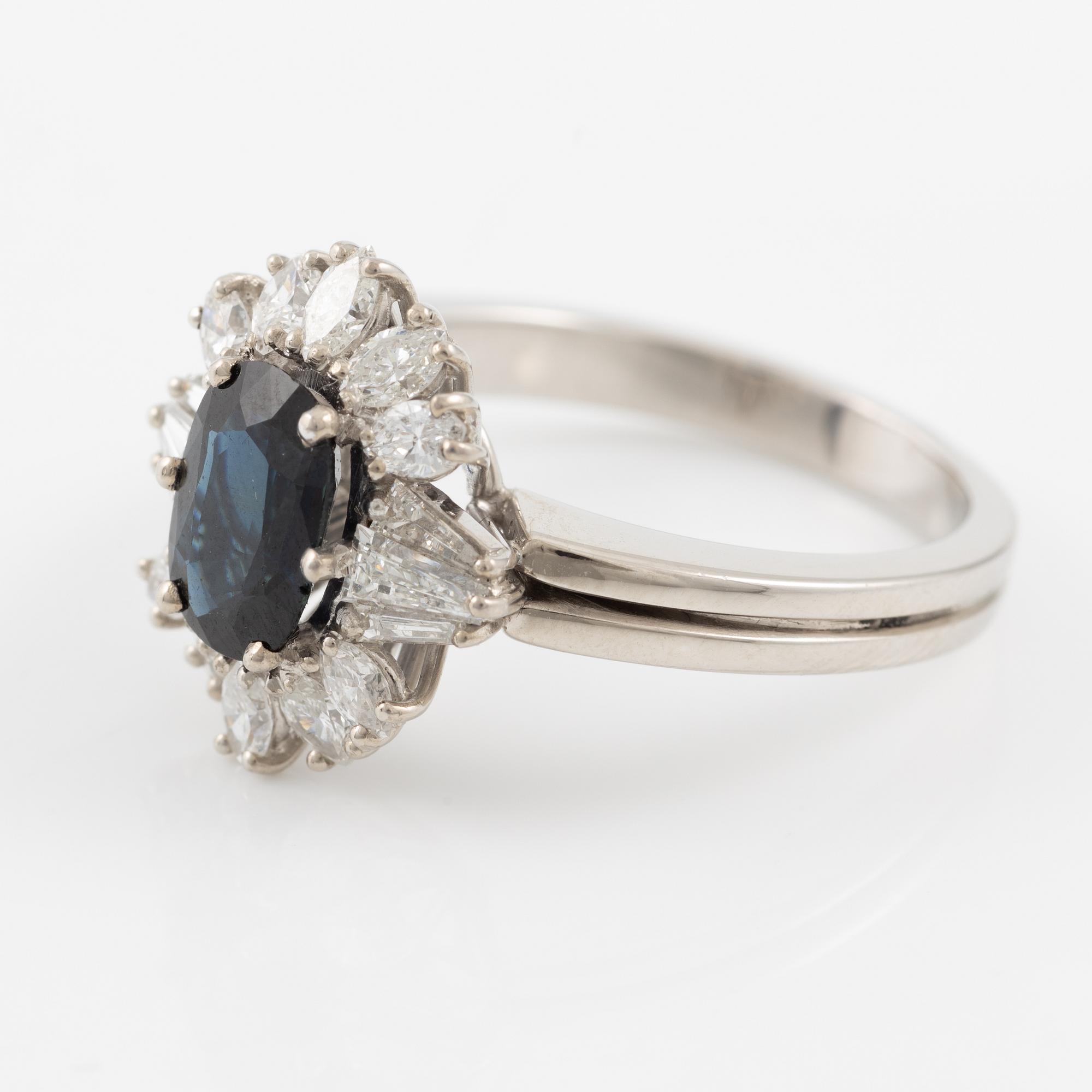 Ring, 18K white gold with sapphire and trapeze- and navette-cut diamonds.