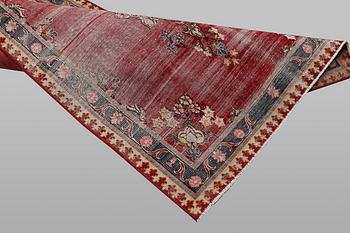 An oriental vintage design rug, c. 207 x 86 cm.