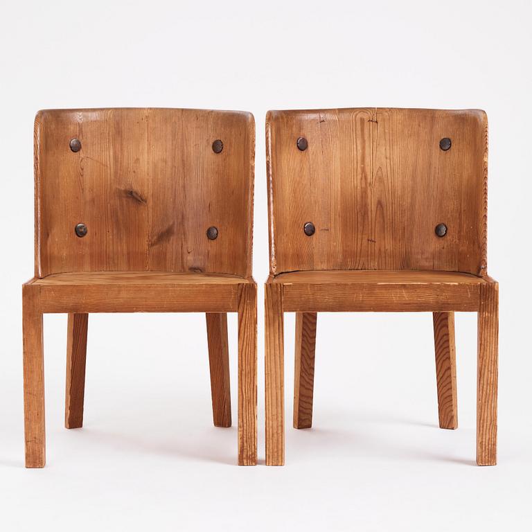 Axel Einar Hjorth, a pair of "Lovö" stained pine armchairs, Nordiska Kompaniet 1930s.