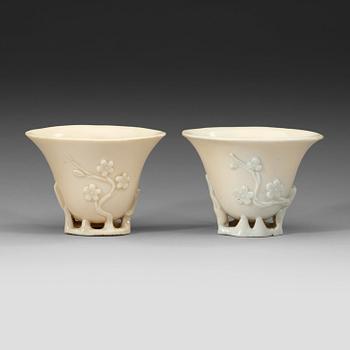 A pair of blanc de chine libation cups, Qing dynasty 18th century.