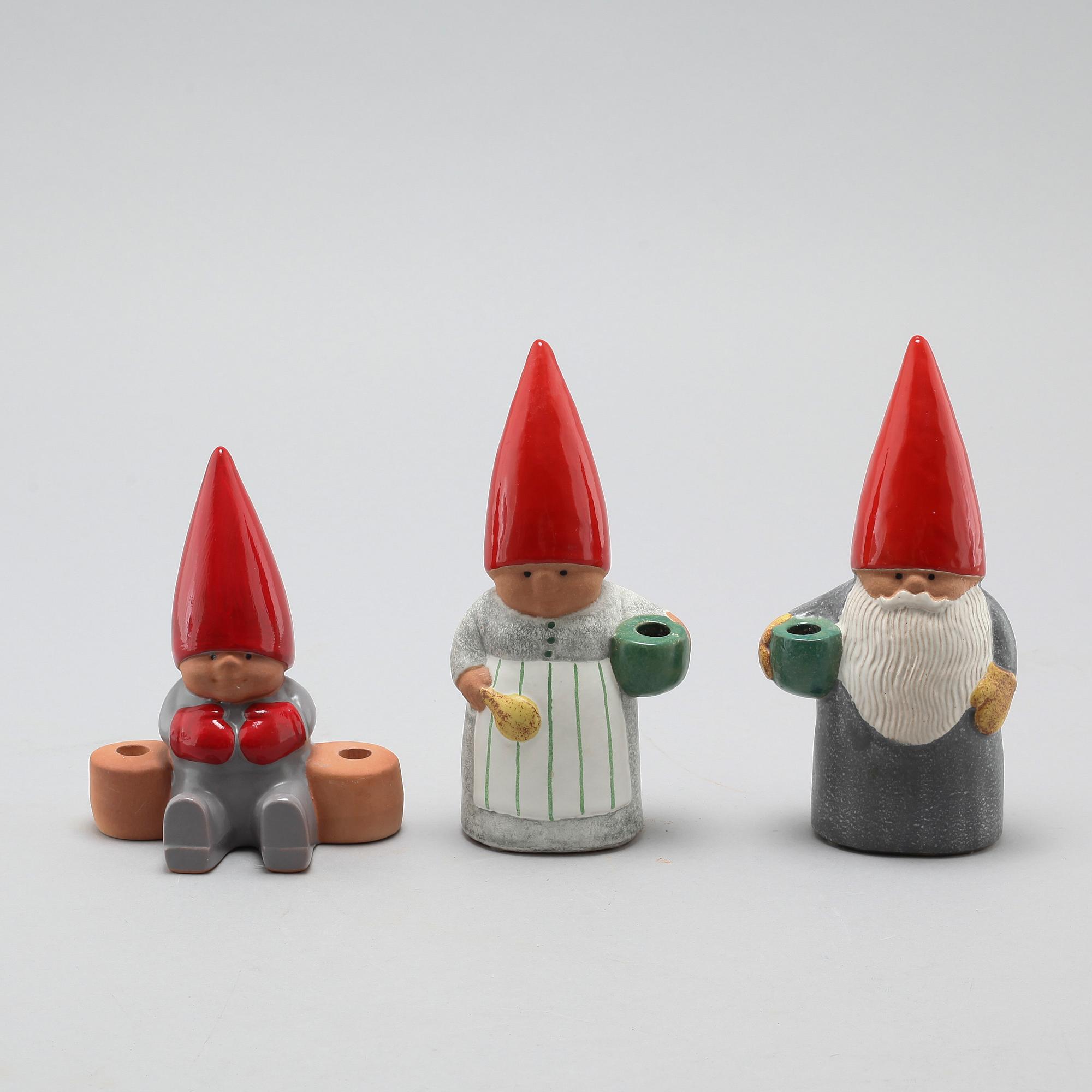Three ceramic candlesticks by Lisa Larson for Gustavsberg, partly signed.