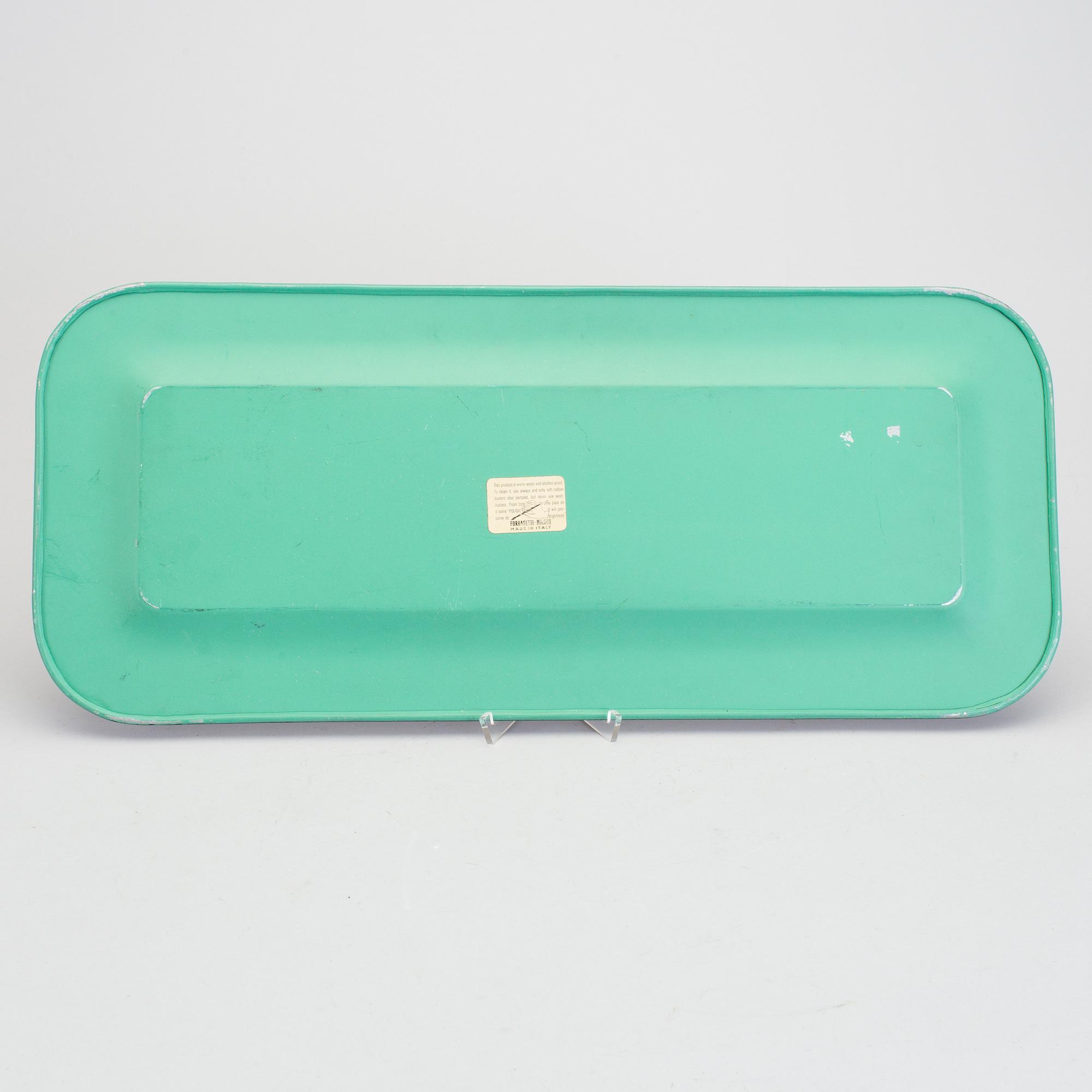 A Piero Fornasetti tray.