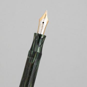 Montblanc, a fountain pen and a pencil in a leather case, 1950's.