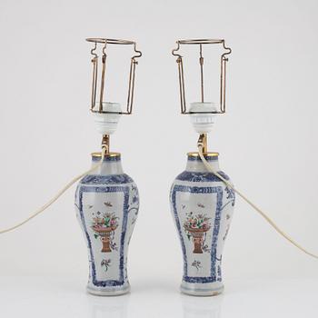 A pair of Chinese porcelain table lights/vases, 18th Century.