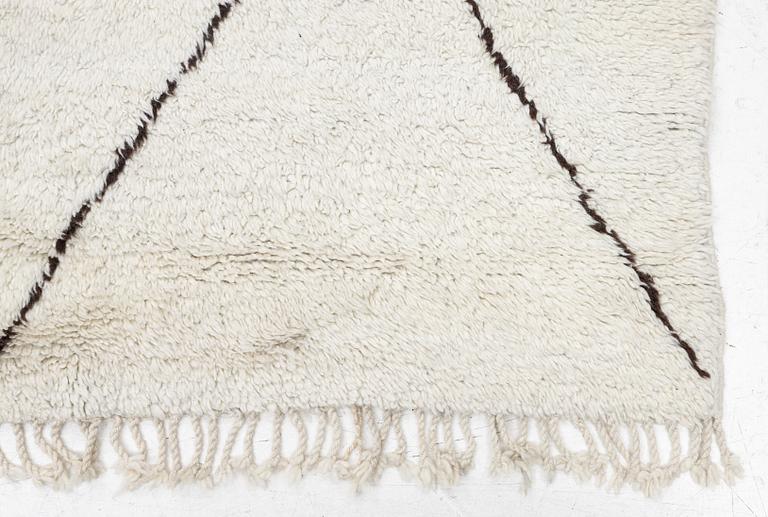 A Moroccan carpet, c. 282 x 150 cm.