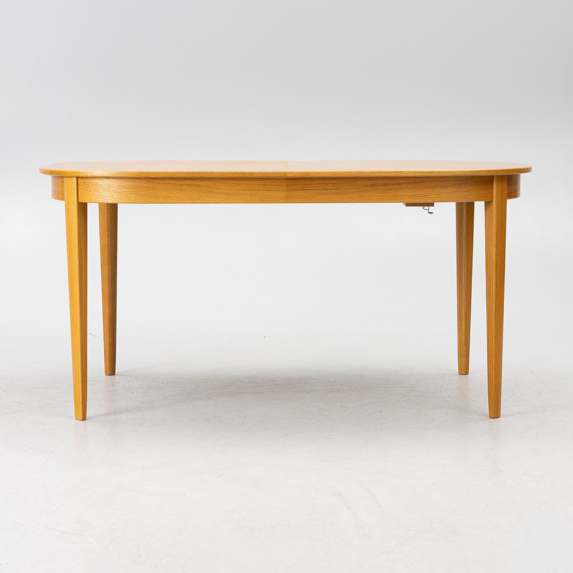 Carl Malmsten, a dining table with eight chairs, 'Camlare Nyckel', Sweden, second half of the 20th century.