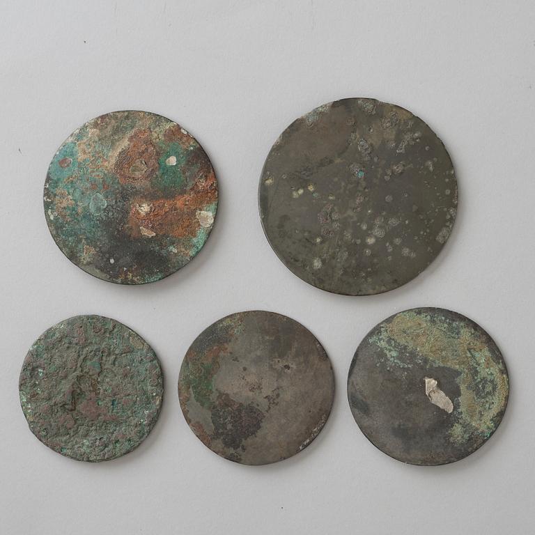 A group of five bronze mirrors, Han dynasty.