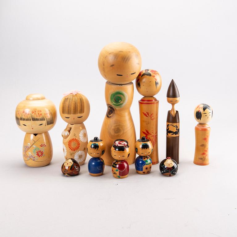 A set of 12 different Japanese Kokeshi-dolls mid 1900s.