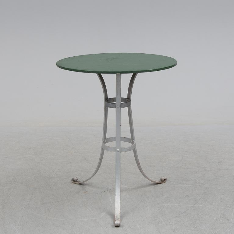 A garden table and four chairs, first half of the 20th century.