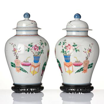 A pair of famille rose 'ladies and boys' vases with covers, late Qing dynasty.