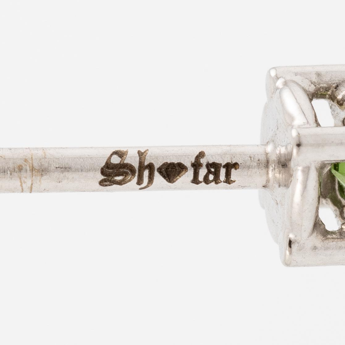 Earrings 18K white gold with colour-treated green brilliant-cut diamonds.