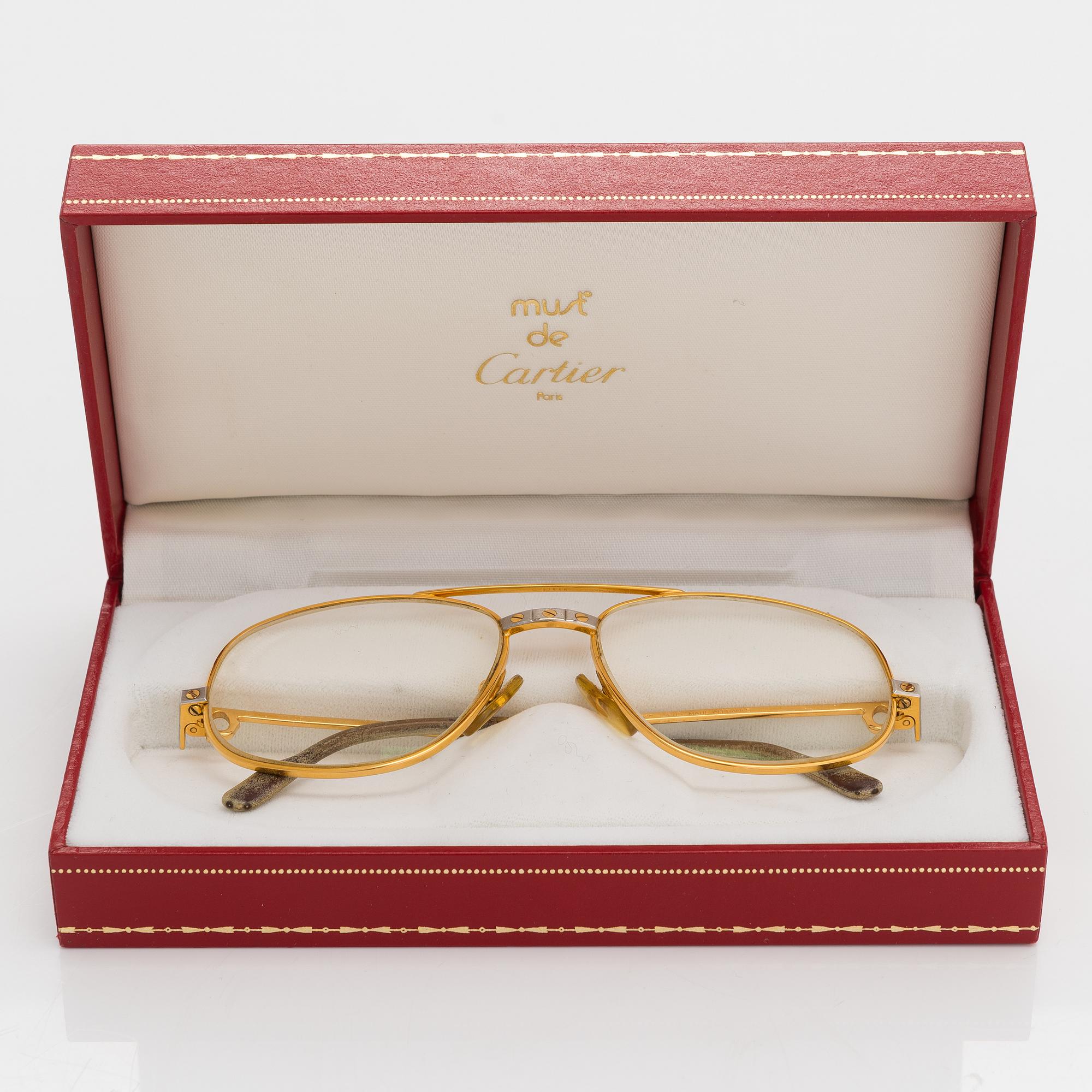 must de Cartier Santos a pair of eyeglass frames. Marked Cartier Paris Made in France 135 54 16. Bukowskis